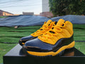 Air Jordan 11 Orange, Yellow & Black Sneakers