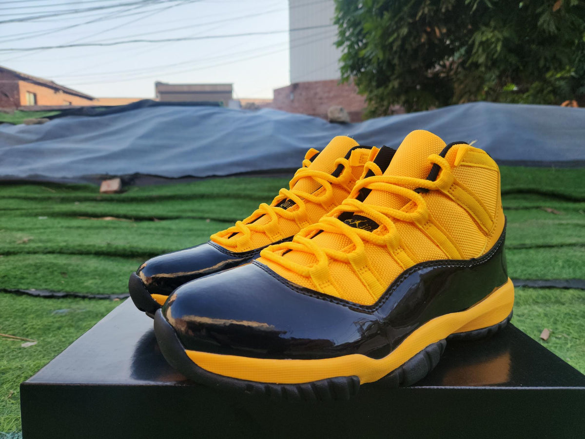 Air Jordan 11 Orange, Yellow & Black Sneakers