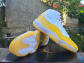 Air Jordan 11 White & Yellow Sneakers