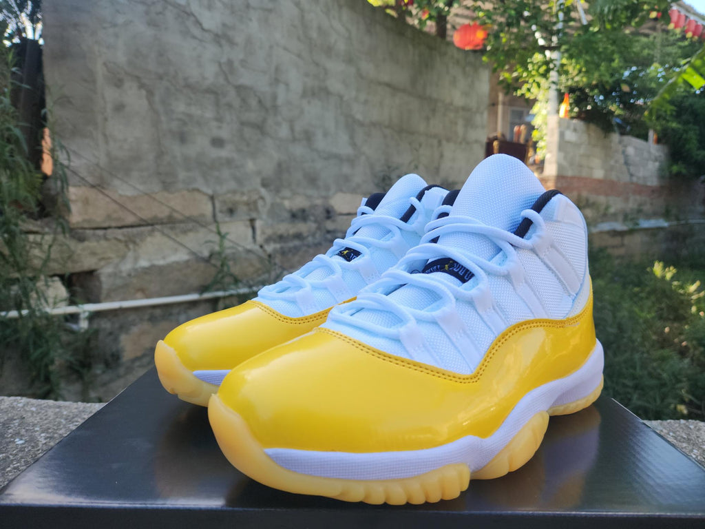 Air Jordan 11 White & Yellow Sneakers