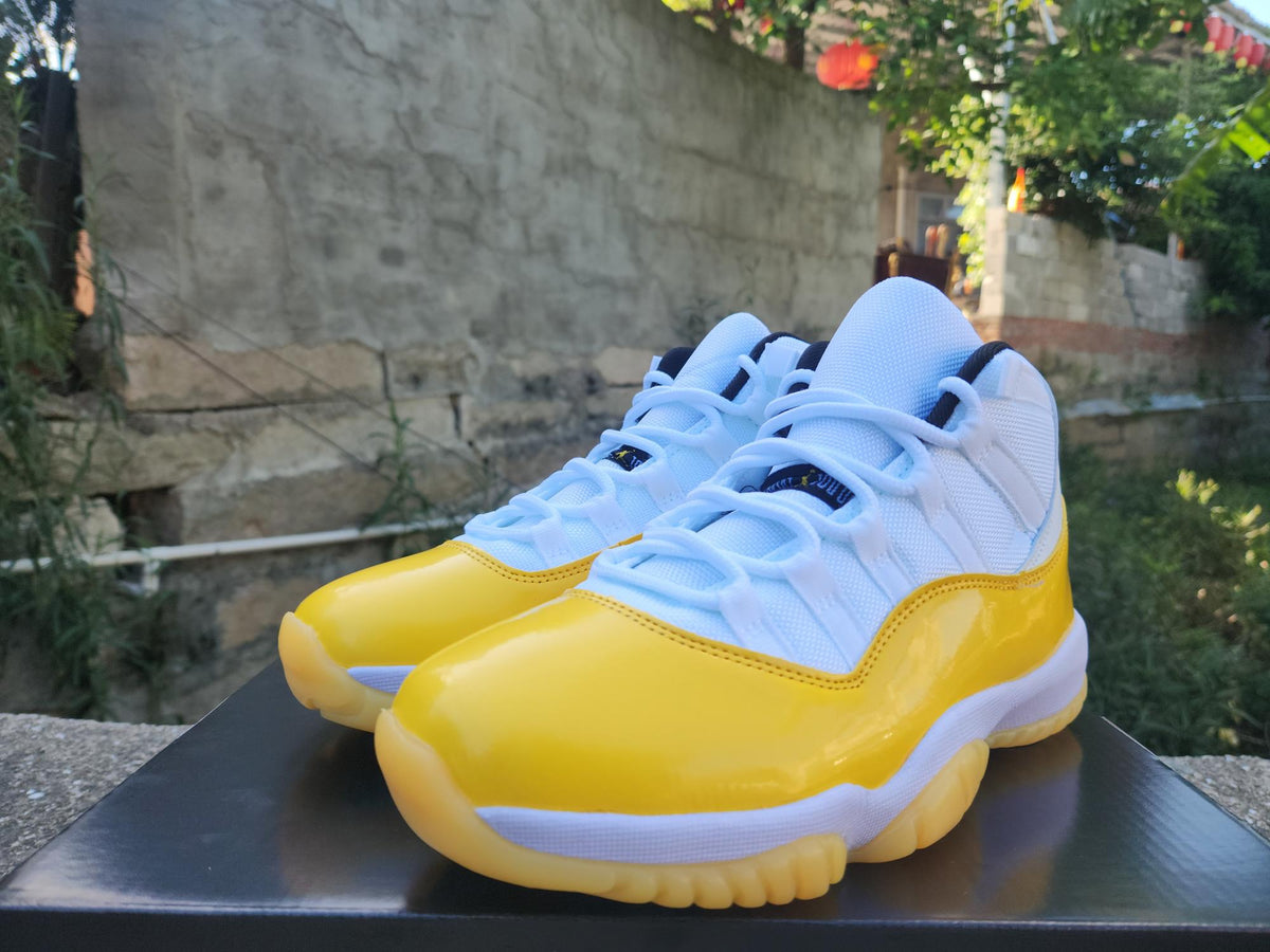 Air Jordan 11 White & Yellow Sneakers