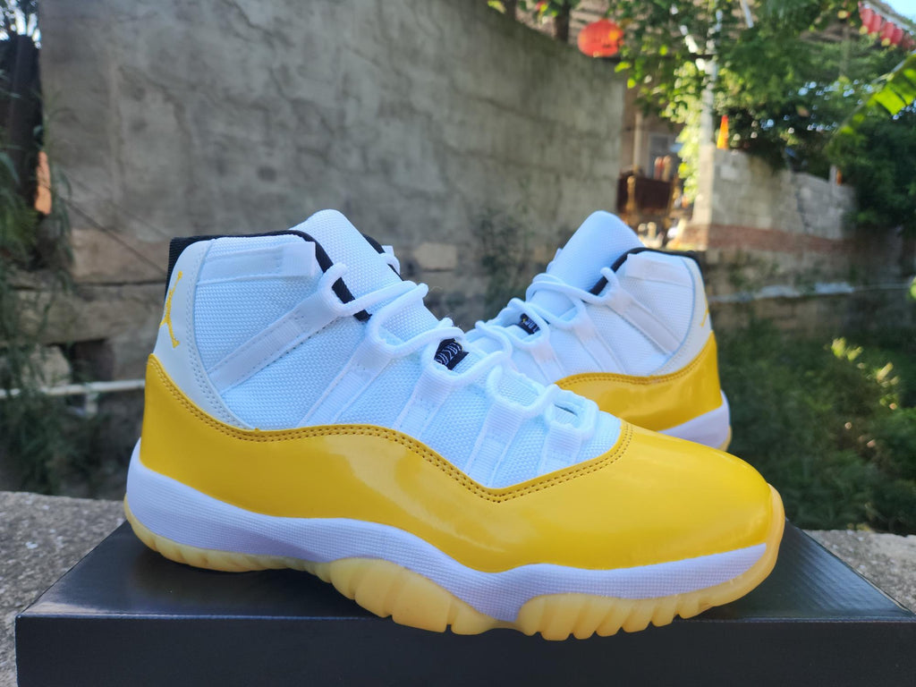 Air Jordan 11 White & Yellow Sneakers