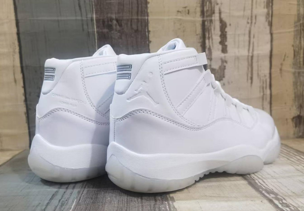 Air Jordan 11 Cream & Black Sneakers
