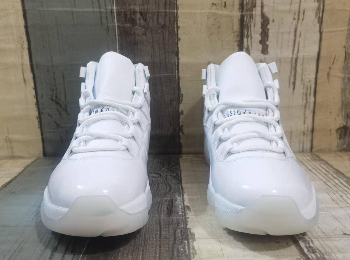 Air Jordan 11 Cream & Black Sneakers