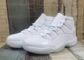 Air Jordan 11 Cream & Black Sneakers