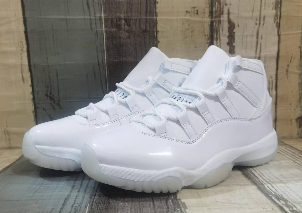 Air Jordan 11 Cream & Black Sneakers